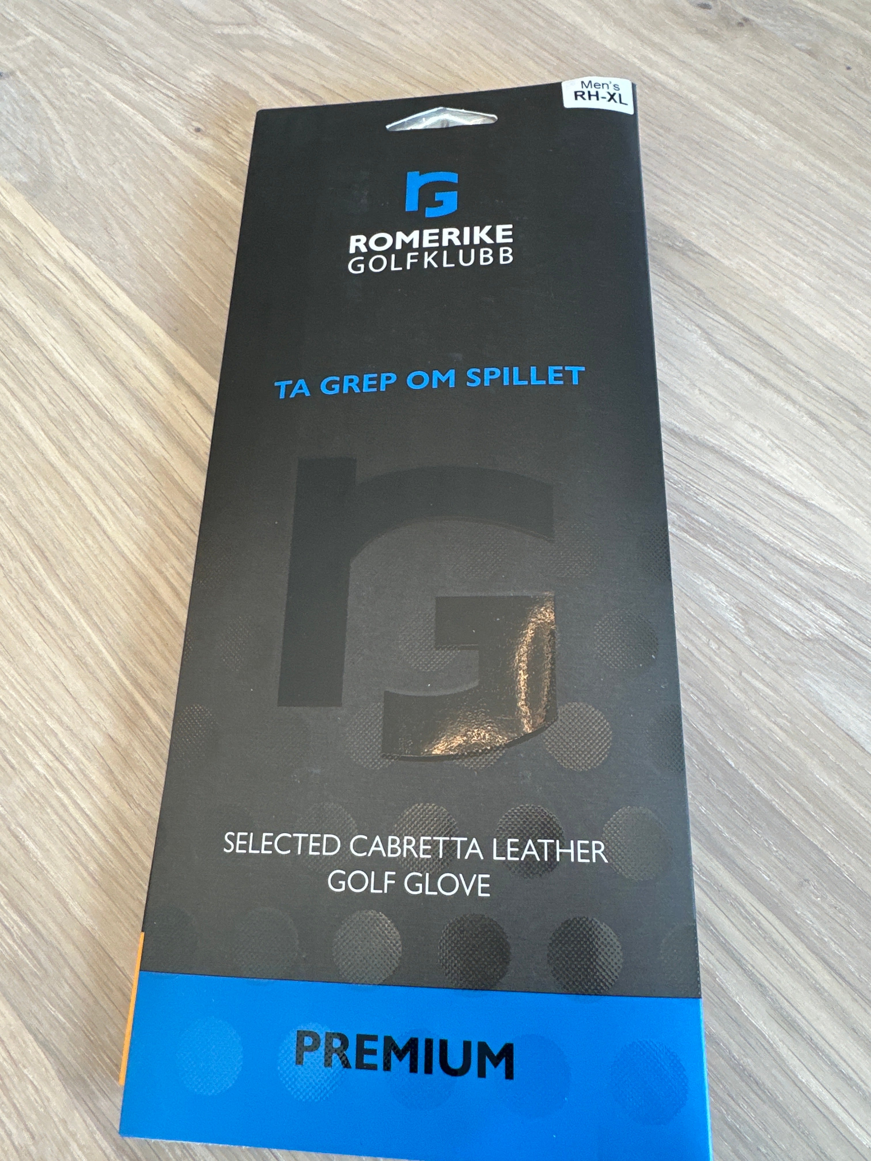 Hansker Romerike GK logo PREMIUM blå